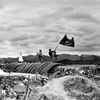 The "Determined to fight, determined to win" flag of the Vietnam People's Army flies on the top of French General De Castries' bunker in the afternoon of May 7, 1954, marking the complete victory of the Dien Bien Phu Campaign. (File photo: VNA)