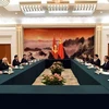 The meeting between the CPV delegation and Wang Huning, member of the Standing Committee of the CPC Central Committee’s Political Bureau and Chairman of the National Committee of the Chinese People’s National Political Consultative Conference, in Beijing on June 13 (Photo: VNA)