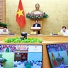 PM Pham Minh Chinh chairs the Government's regular meeting on July 6. (Photo: VNA) 