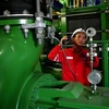 A worker operates equipment at a PV Power plant. PV Power has proposed the implementation of the Clean Energy Production Complex project in Ninh Thuan province, which is worth nearly 4 billion USD. (Photo: VNA)