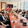 Delegates attend the VCBA's second congress via videoconference at the Vietnamese Consulate General in Vancouver city. (Photo: VNA)