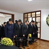Staff members of the Embassy and other representative bodies of Vietnam in Mexico observed a minute of silence in commemoration of Party General Secretary Nguyen Phu Trong on July 25. (Photo: VNA)