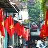 Every year, many streets in Hanoi are decorated with national flags to celebrate the National Day holiday. (Photo: VNA)