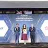 Nguyen Vu Tam, Deputy General Director of PVI Insurance, receives the Top 10 Most Reputable Insurance Companies in Vietnam award on behalf of the company. (Photo courtesy of PVI Insurance)