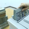 The daily reference exchange rate is set at 24,241 VND/USD on August 5. (Photo: VNA)