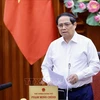 PM Pham Minh Chinh speaks at the meeting between permanent Government members and representatives of ministries and sectors on August 16. (Photo: VNA)