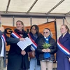 Many politicians and mayors of districts in Paris and nearby cities, along with representatives of left-wing parties and environmental activists come to show support for Tran To Nga (fourth from left) on August 22. (Photo: VNA)