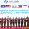 Heads of delegations pose for a group photo at the 21st ASEAN Chiefs of Defence Forces Meeting (ACDFM-21) in Vientiane, Laos, on September 5. (Photo: VNA)