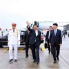 General Secretary of the Lao People’s Revolutionary Party Central Committee and President of Laos Thongloun Sisoulith (centre) arrives at Noi Bai International Airport in Hanoi on September 10 morning. (Photo: VNA)