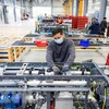 Workers at a factory in Herten town, Germany (Illustrative photo: AFP/VNA)