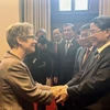 NA Vice Chairman Nguyen Duc Hai (right) meets with Speaker of the Canadian Senate Raymonde Gagne in Ottawa on October 1. (Photo: VNA)