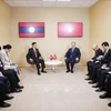 The meeting between General Secretary of the CPV Central Committee and State President To Lam (right) and General Secretary of the LPRP Central Committee and President of Laos Thongloun Sisoulith in Paris on October 5 (Photo: VNA)