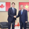 Party General Secretary and State President To Lam (right) meets with Canadian Prime Minister Justin Trudeau in Paris on October 5. (Photo: VNA)