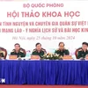 Some participants in a symposium held by the Vietnamese Ministry of National Defence in Hanoi on October 25 to look into the historical signifiance and lessons from the Vietnamese volunteer soldiers and military experts in Laos. (Photo: VNA)