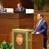 PM Pham Minh Chinh fields legislators' questions at the 15th NA's ongoing 8th session on November 12. (Photo: VNA)