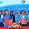 Representatives of the women's unions of Dien Bien province and the three Lao provinces sign an MoU for 2024 - 2026. (Photo: VNA)