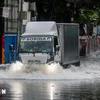 A road in Quezon province, the Philippines, is flooded following a storm in October 2024. (Photo: Xinhua/VNA)