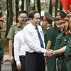 NA Chairman Tran Thanh Man greets officers of the Hau Giang Military Command on December 14. (Photo: VNA)