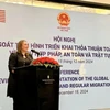 IOM Chief of Mission Kendra Rinas speaks at the conference in Hanoi on December 18. (Photo: VNA)