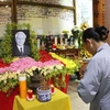  La communauté vietnamienne du Laos commémore le secrétaire général Nguyen Phu Trong. Photo: VNA