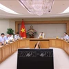 Le vice-Premier ministre Tran Hong Ha préside la réunion visant à donner des avis sur le projet de Plan de développement du marché vietnamien du carbone, le 22 août à Hanoï. Photo: VNA