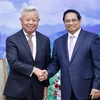 El primer ministro vietnamita, Pham Minh Chinh, recibe a Jin Liqun, presidente del Banco Asiático de Inversión en Infraestructura (BAII). (Fuente:VNA)