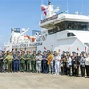 Representantes vietnamitas e indonesios se tomaron una foto de recuerdo en en el puerto PTSC de la ciudad de Vung Tau. (Fuente: VNA)