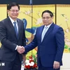 El primer ministro de Vietnam, Pham Minh Chinh, recibió al presidente de la Región Autónoma Zhuang de Guangxi (China), Lan Tianli. (Fuente: VNA)