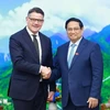 El primer ministro vietnamita, Pham Minh Chinh, y el ministro-presidente de ese estado alemán, Boris Rhein. (Fuente: VNA)