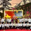 Toman fotos de recuerdo delegados e invitados en el acto por el 79º aniversario del Día Nacional de Vietnam en Tanzania (Fuente: VNA)