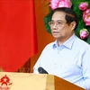 El primer ministro Pham Minh Chinh preside la reunión del Comité Directivo para revisar y abordar los problemas en documentos legales. (Fuente: VNA)