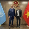 El embajador Dang Hoang Giang, jefe de la delegación de Vietnam ante las Naciones Unidas (ONU) y Andreas Schaal, director de Relaciones y Cooperación Globales de la OCDE en la reunión en Nueva York. (Fuente: VNA)