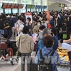 Pasajeros en el aeropuerto internacional de Jeju (Fuente: AFP/VNA)