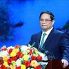 Le Premier ministre Pham Minh Chinh prend la parole lors de la conférence. Photo: VNA