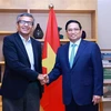 Le Premier ministre vietnamien Pham Minh Chinh (droite) et le président Rajesh Kumar Singh de la Société nationale indienne de développement du corridor industriel (NICDC). Photo: VNA