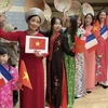 Des femmes vietnamiennes participent à un défilé en France en mars 2022 à l'occasion de la Journée internationale de la Francophonie (20 mars). Photo : VNA