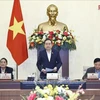 Le président de l’AN Tran Thanh Man (debout) à l’ouverture de la réunion. Photo : VNA