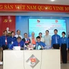 Las organizaciones juveniles de la ciudad de Da Nang y la localidad laosiana de Salavan firman el memorando de entendimiento. (Foto: VNA)