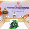 El primer ministro Pham Minh Chinh preside la conferencia para promover la diplomacia económica. (Foto: VNA)