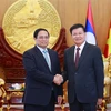 El primer ministro de Vietnam, Pham Minh Chinh, se reúne con el secretario general del Comité Central del Partido Popular Revolucionario y el presidente de Laos, Thongloun Sisoulith