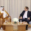 Le Premier ministre Pham Minh Chinh (droite) a reçu Saad bin Sherida Al Kaabi, ministre d'État aux affaires énergétiques et PDG de QatarEnergy. Photo : VNA