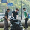 Foreigners assist with cleanup efforts in Hanoi following Typhoon Yagi