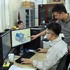 Engineers of Tomeco company in Hanoi's Ngoc Liep Industrial Cluster discuss industrial fan design (Photo: VNA)