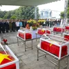 Memorial and burial service held for the remains of 12 Vietnamese volunteer soldiers and experts who laid down their lives in Laos. (Photo: VNA)