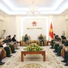General Phan Van Giang receives Lao Ambassador Khamphao Ernthavanh in Hanoi on July 3. (Photo: VNA)