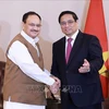 Prime Minister Pham Minh Chinh (R) receives President of the Bharatiya Janata Party Jagat Prakash Nadda (Photo: VNA)