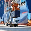 Containers being loaded at Gemalink International Port in Ba Ria - Vung Tau province (Photo: VNA)