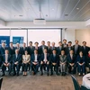 Vietnamese officials posing for a photo with Australian officials (Photo: VNA)