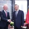 Party General Secretary and State President To Lam (R) receives President of Boeing Global Brendan Nelson. (Photo: VNA)