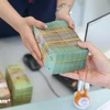 The State Bank of Vietnam sets daily reference exchange rate for the US dollar at 24,146 VND/USD on September 24 (Photo: VNA)